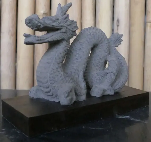 Product image of the product “Reclining dragon, on a wooden base, approx. 16 cm. antique finish, cast lava stone ”